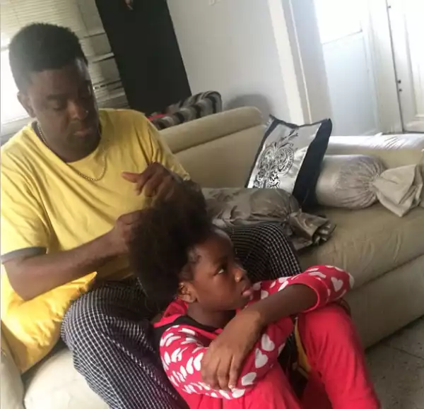 Adorable Photo Of Kunle Afolayan Braiding His Daughter’s Hair
