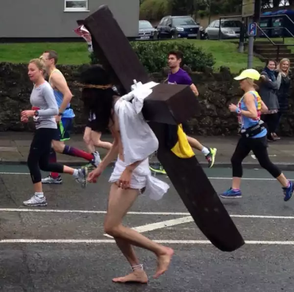 Man Dressed As Jesus Carrying A Cross Runs In  London Marathon