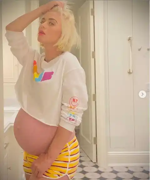 Pregnant Katy Perry showcases her baby bump in new photos