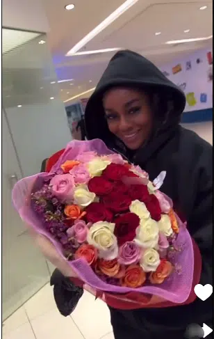 Cute moment Neo gives Beauty flowers and his jacket as she lands at South African airport